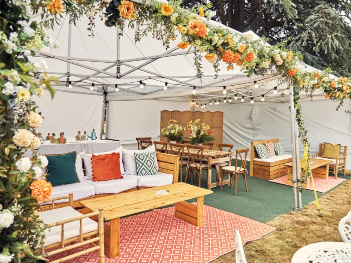 soho house festival london VIP area with rustic furniture hire